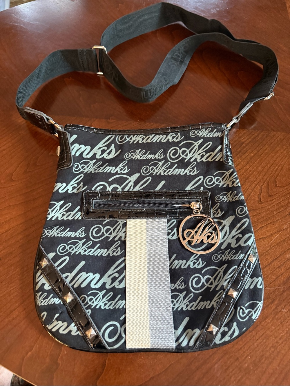 Black Script Crossbody Bag with Silver Charm